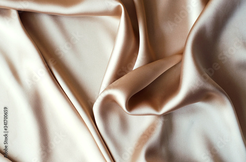 Background from satin fabric of golden color.