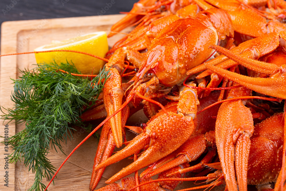 Boiled crayfish, served to beer with lemon and greens Boiled crayfish, served to beer with lemon and greens