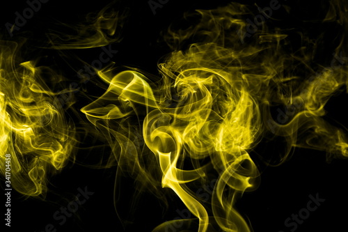 Yellow smoke on black background