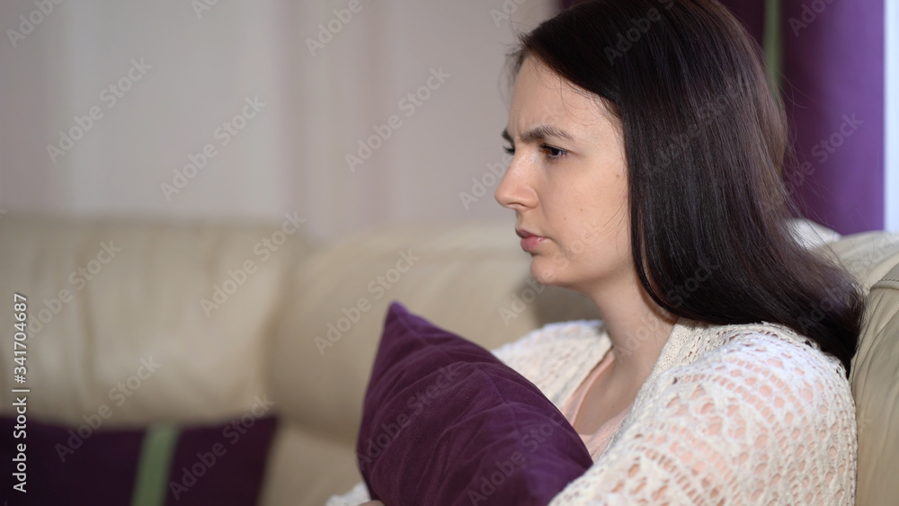 Naklejka premium Stressed Young Woman Thinking of Health Problems. Sadness Young Woman Having Depression Due to Coronavirus Outbreak. Quarantine Covid-19 Corona Virus. Social Distancing Concept.