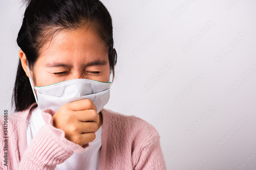 woman wearing surgical protection cloth face mask hygiene against coronavirus and her sneeze woman wearing surgical protection cloth face mask hygiene against coronavirus and her sneeze
