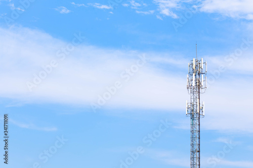 Telephone pole or cell tower in clear sky background.