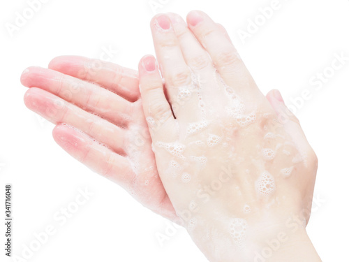 Hand washing with antibacterial soap on a white background, close-up. Protection from the virus in a pandemic coronavirus, influenza and covid-19. The concept of cleanliness and disinfection