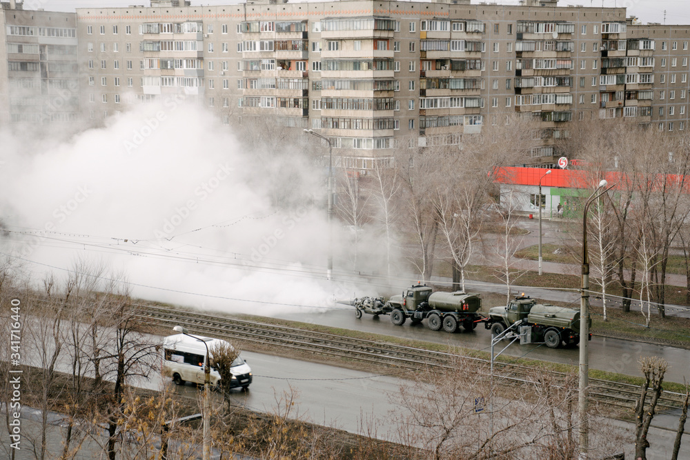 Obraz Russia, Chelyabinsk region, the city of Magnitogorsk - April 15, 2020 - Meticulous disinfection and decontamination on the streets as a prevention against Coronavirus disease (SARS-Cov-2).