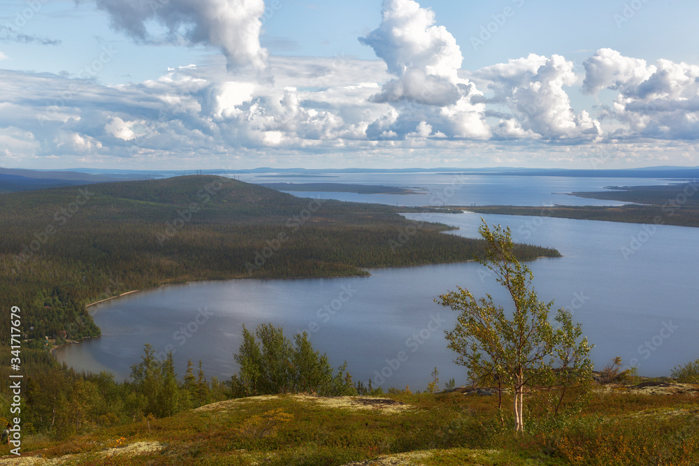View from the mountain to the lake.Lapland zapovednik in autumn day. Kola Peninsula. Russia