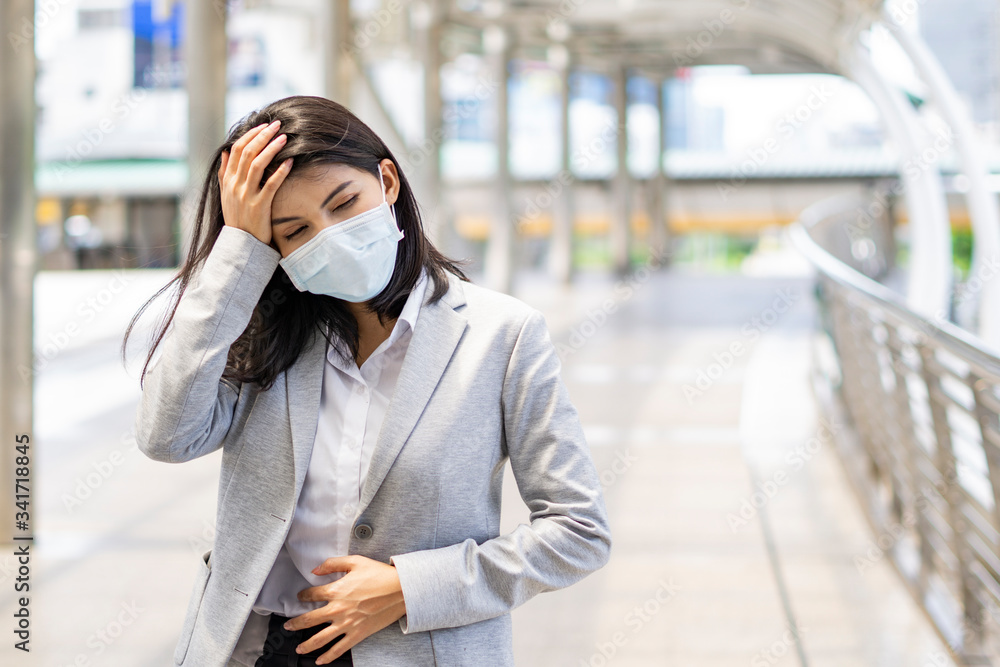 Fototapeta premium Coronavirus a woman wearing face mask on blur background. Coronavirus, healthcare and air pollution concept