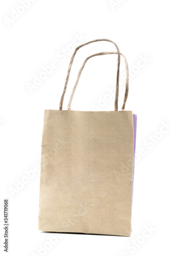 Brown recycle paper bag To help reduce global warming Instead of using a plastic bag White background or isolated