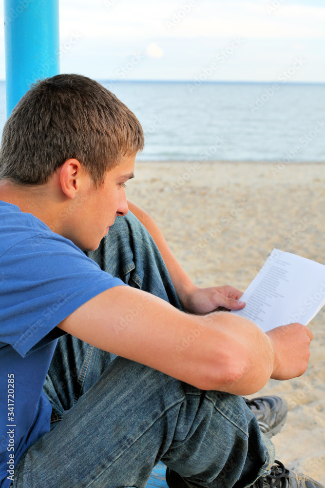 teenager read paper outdoor