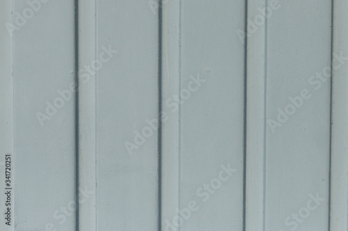 White background with vertical lines (garage door)