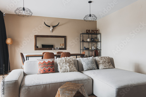 modern living room with big sofa and mirror