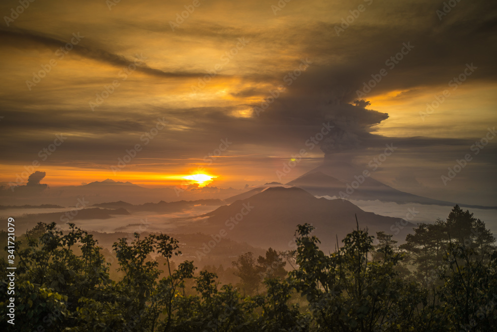 Series of photos from the eruption volcano Agung in Bali with beautiful views of the nature and volcano Batur. Big smoke and ash cover the sky Series of photos from the eruption volcano Agung in Bali with beautiful views of the nature and volcano Batur. Big smoke and ash cover the sky