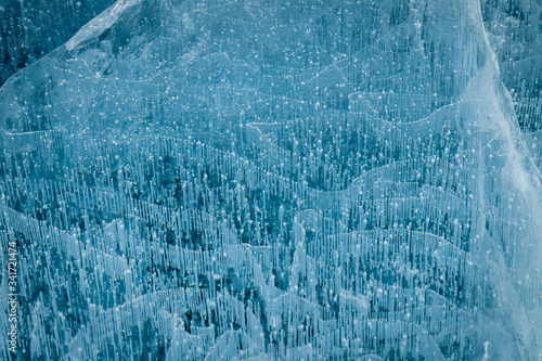 Texture of transparent ice with cracks on lake Baikal