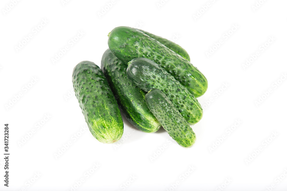Group of fresh green pickling cucumbers on white background Group of fresh green pickling cucumbers on white background