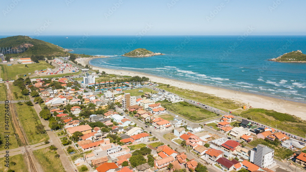 Aerial view of vila beach (Praia da Vila). Beatiful beach in Imbituba city, Santa Catarina, Brazil