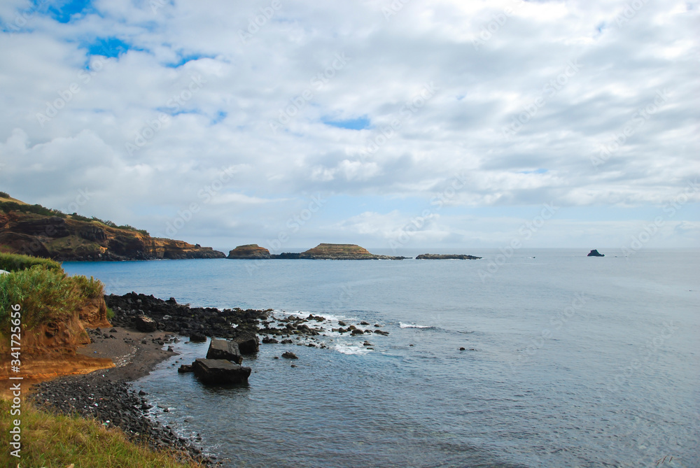 A panorama view at nature in Terceira Island, Azores, Portugal with plants and the ocean A panorama view at nature in Terceira Island, Azores, Portugal with plants and the ocean