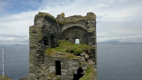 Aerial orbit of Irish ruined castle 