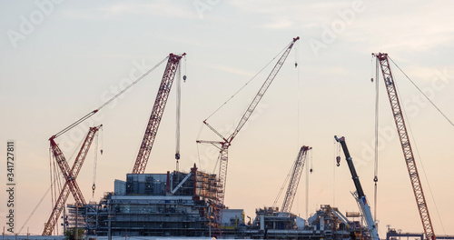 Construction site and sunset, beam, steel structure, build large residential buildings on the construction site