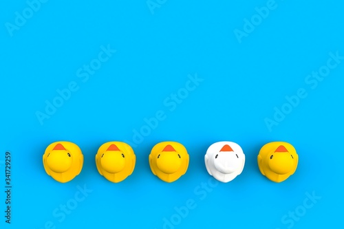 Close up of baby rubber ducks isolated. Bath toys on a blue background. Top view with copy space. Summer wallpaper. 3d rendering.