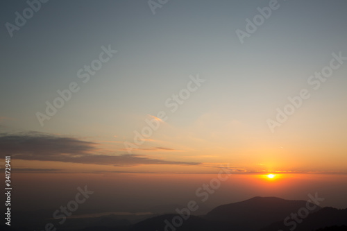 silhouette mountain have little bit cloud and sunrise background