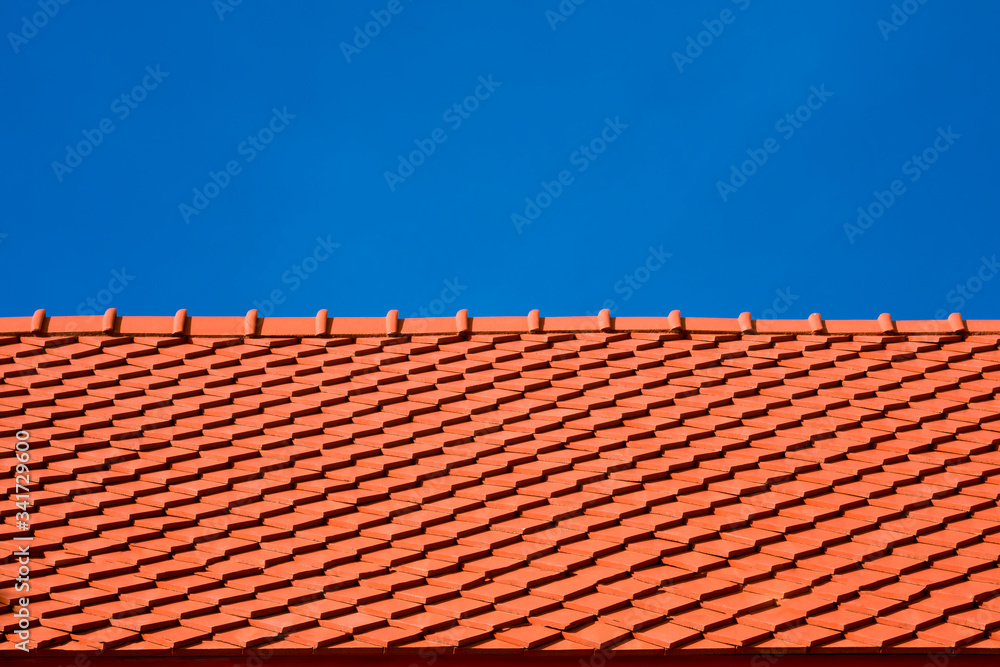 Low angle view of red tiles roof slope in horizontal pattern against blue clear sky in sunny day, exterior architecture concept
Low angle view of red tiles roof slope in horizontal pattern against blue clear sky in sunny day, exterior architecture concept