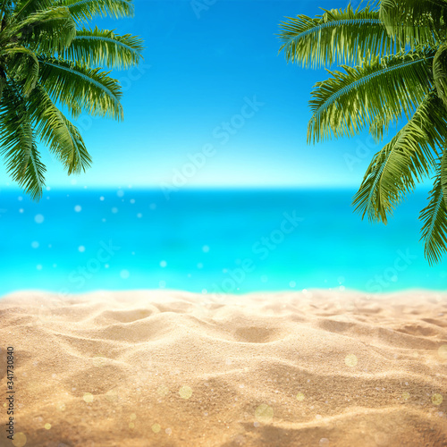 Summer sandy beach with blured tropical sea view with empty space for product display advertistment