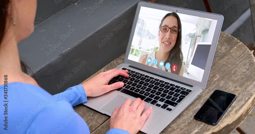 Woman talking on video meeting on her laptop Woman talking on video meeting on her laptop