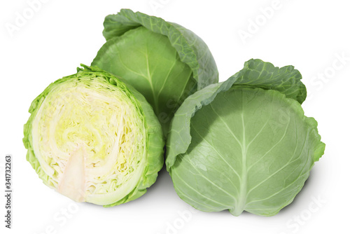 Group of green heads of white cabbage with sliced one on a white background