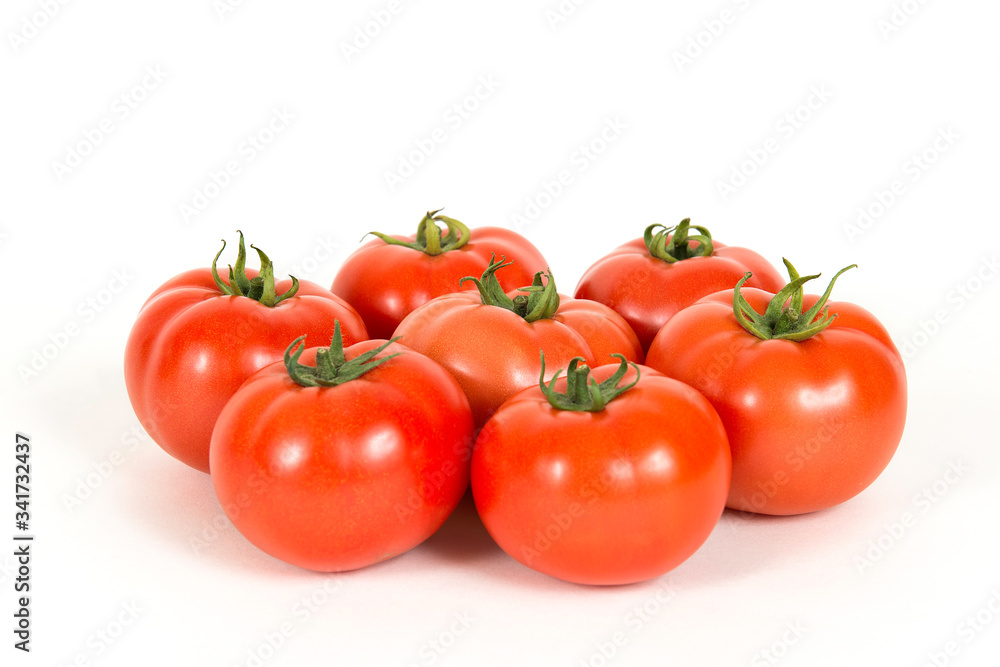 Red fresh tomatoes on a white background Red fresh tomatoes on a white background