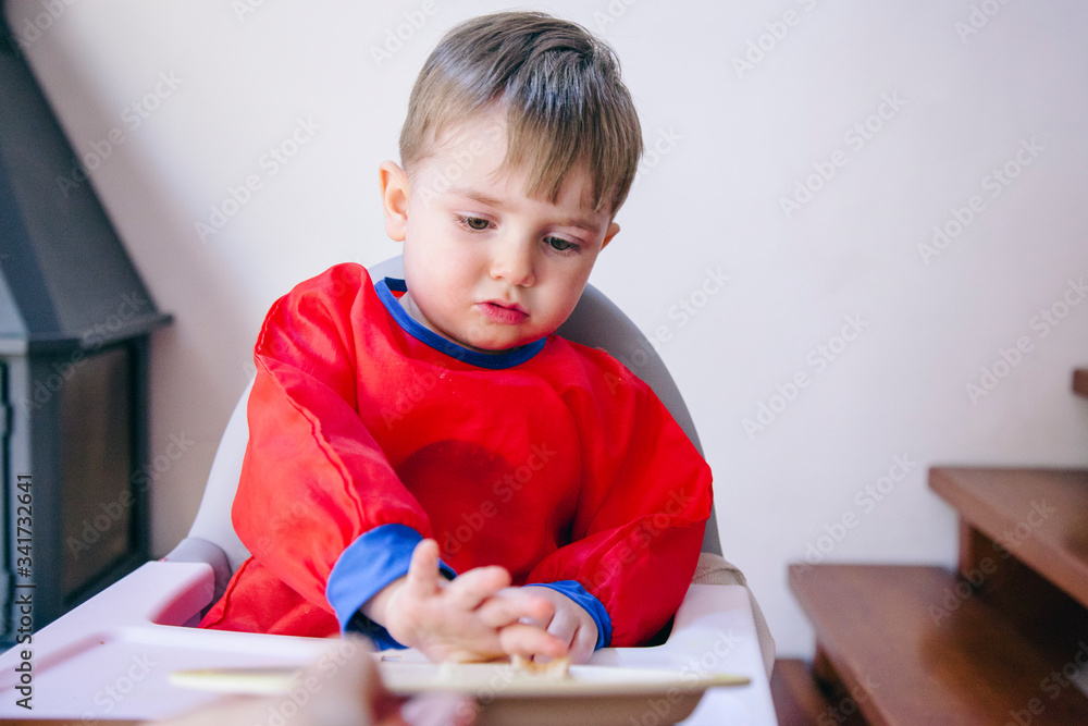 hungry little baby boy who does not want to eat vegetables. Problems of behavior for eating raising little kids. hungry little baby boy who does not want to eat vegetables. Problems of behavior for eating raising little kids.