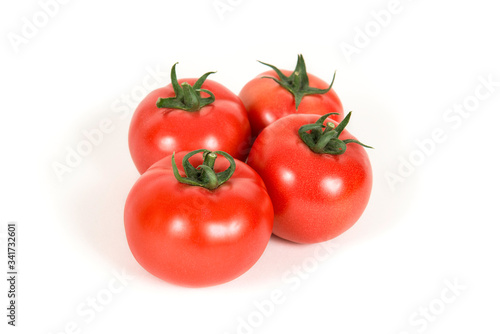 Group of red fresh tomatoes on a white background
