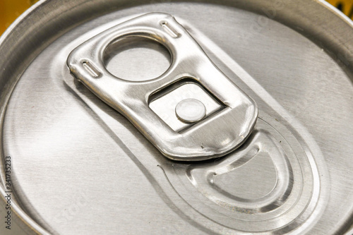 Close up view of the ring pull on an unopened can of drink