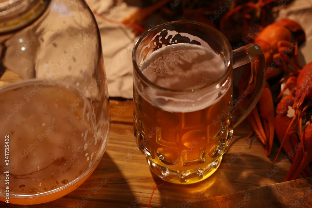Crayfish with beer on a wooden table Crayfish with beer on a wooden table