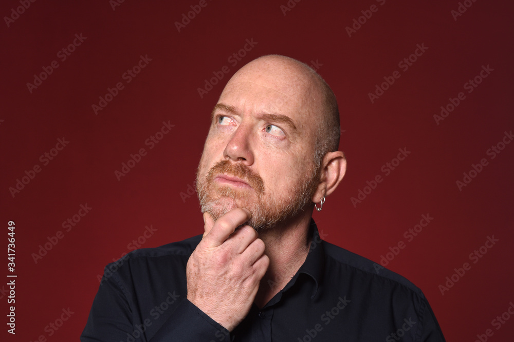 man pensive on red background man pensive on red background