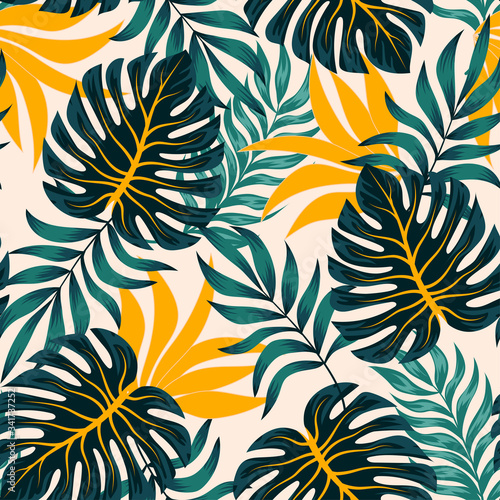Abstract seamless tropical pattern with bright plants and leaves on a beige background. Modern abstract design for fabric, paper, interior decor. Tropical botanical.