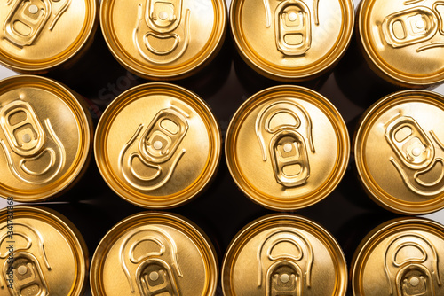 Group of golden aluminium cans in a row, cold drink.