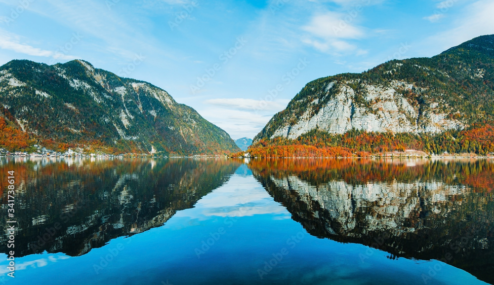 Panoramic view of the famous mountain village Hallstatt, Austria. Lake with reflections.