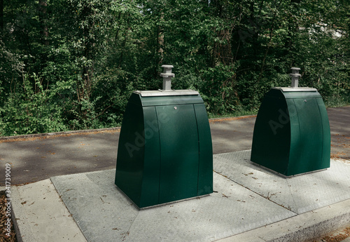 Underground garbage containers in the yard. © Andrew