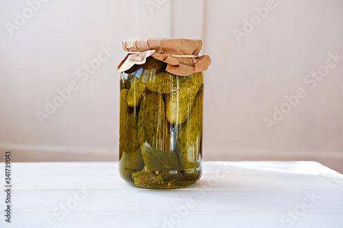 Obraz na plátně fermented cucumbers, pickled marinated cucumbers in a glass jar