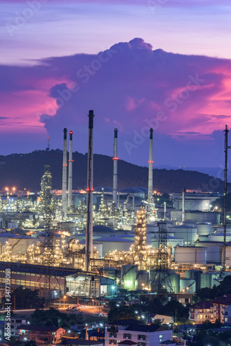 Landscape of oil refinery industry with oil storage tank at sunset