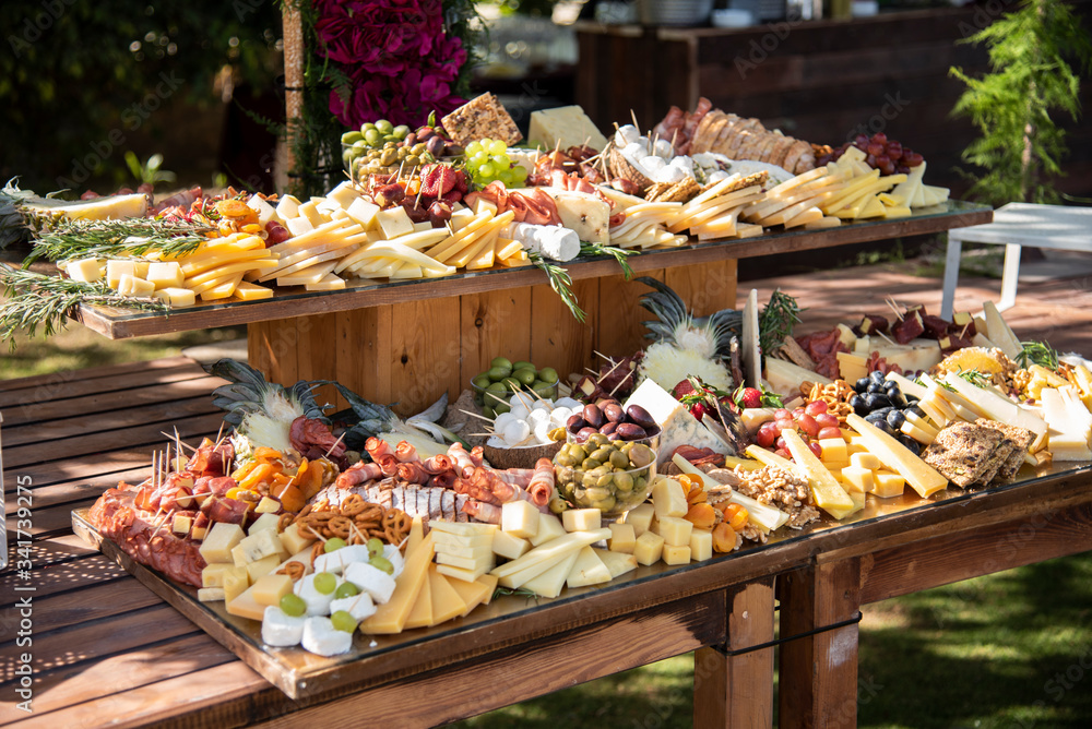 A table full of cheese and appetizers for a party or  wedding  