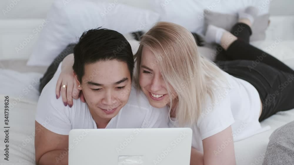 Korean-European marriage is in self-isolation. The family is watching movies on laptop. The good way to spend time on quarantine. Korean-European marriage is in self-isolation. The family is watching movies on laptop. The good way to spend time on quarantine.