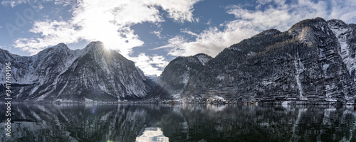 A body of water with a mountain in the background