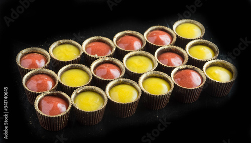 chocolate candies on black stone