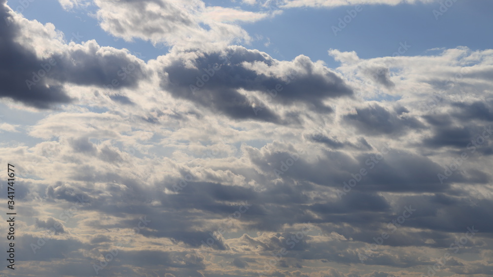 Fluffy clouds of the spring sky. Cold sky with clouds. Fluffy clouds of the spring sky. Cold sky with clouds.