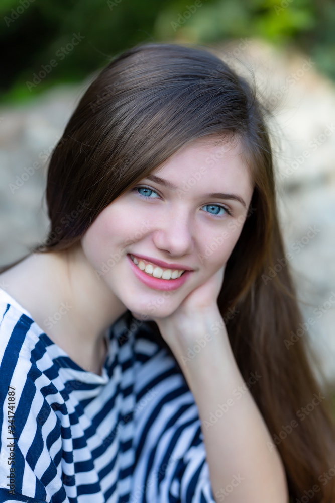 Beautiful teen girl in a marine striped shirt