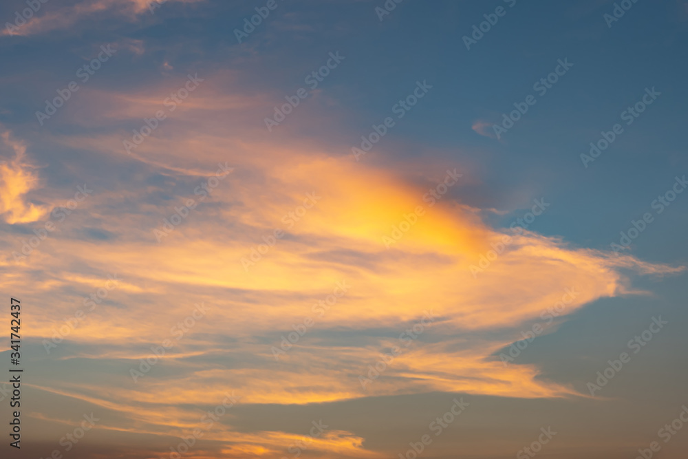 Dramatic cloudy sky during sunset, Texture of bright evening sky in twilight time background Dramatic cloudy sky during sunset, Texture of bright evening sky in twilight time background