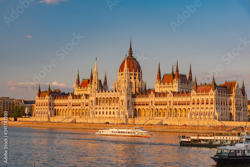 sunset over the river in the city of Budapest with the Parliament
