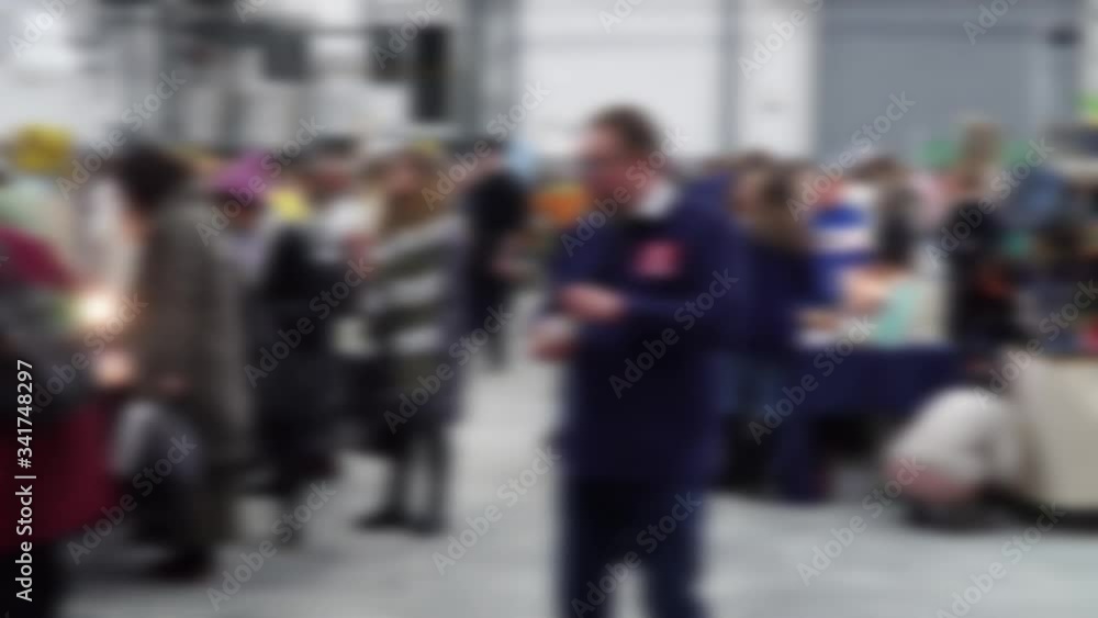 Defocused, blurred image of a crowd of people. Flea market, hangar fair, garage sale. Defocused, blurred image of a crowd of people. Flea market, hangar fair, garage sale.