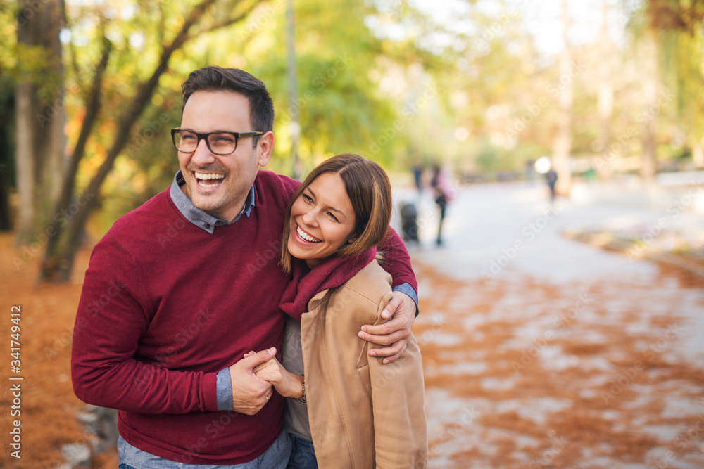 Beautiful couple in the park hugging. Beautiful couple in the park hugging.