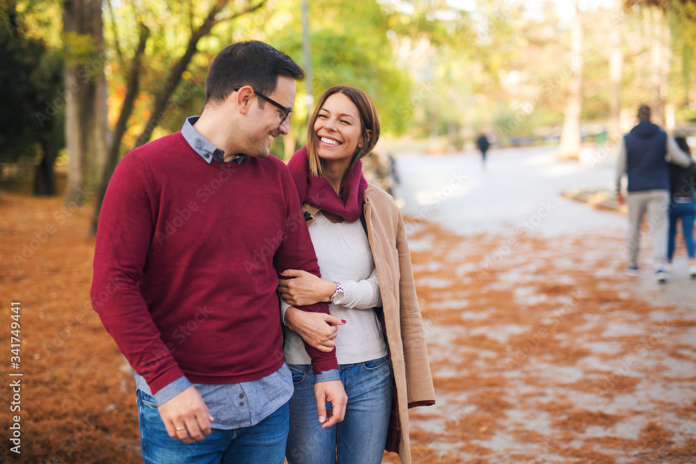 Beautiful couple in the park enjoying autumn. Beautiful couple in the park enjoying autumn.